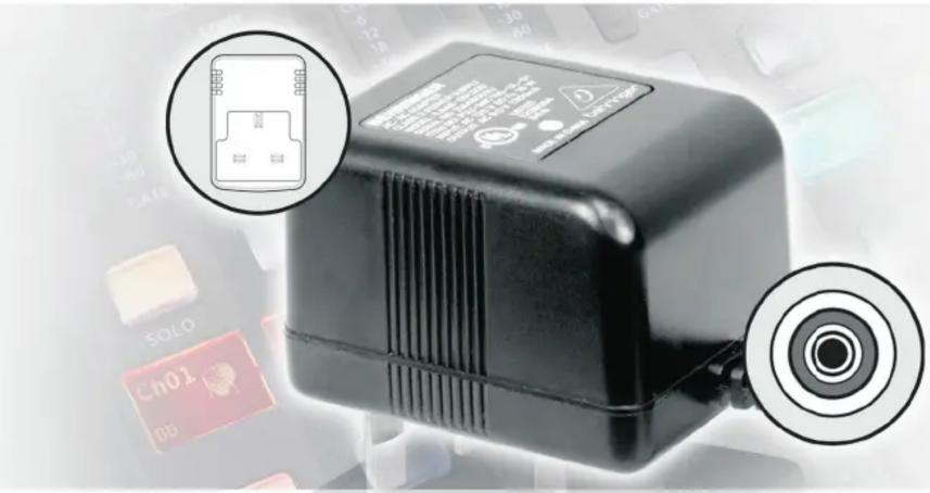 Close-up of a black electronic device with labeled ports and sensor icons, including a close-up inset showing internal connector details.