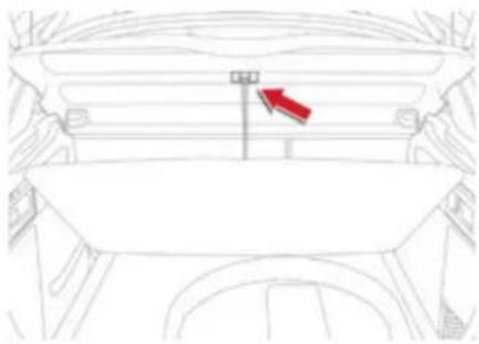 Top-down line drawing of a car's front compartment with a red arrow pointing to the exhaust pipe (no text or symbols)
