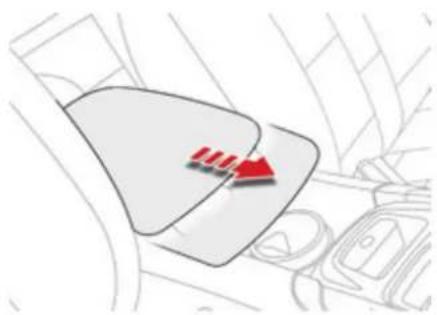 Interior view of a car dashboard with a highlighted red triangular component (no text or symbols)