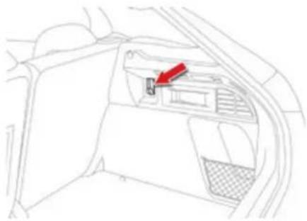 Interior view of a car showing the dashboard and seat area with a red arrow pointing to the intake (no text or symbols present)