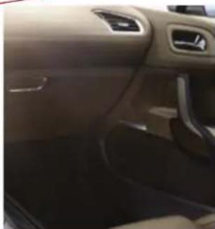 Interior view of a car showing the dashboard and seat area (no visible text or symbols)