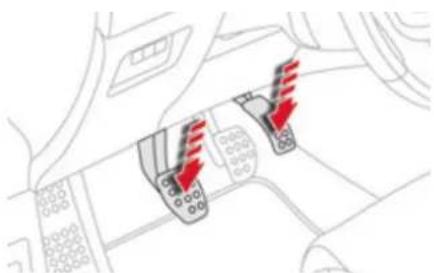 Diagram showing vehicle interior with red traffic cone icons and directional arrows indicating movement or flow