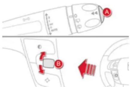 Diagram showing car interior and steering wheel controls with labeled parts A and B, including directional arrows and distance markers.