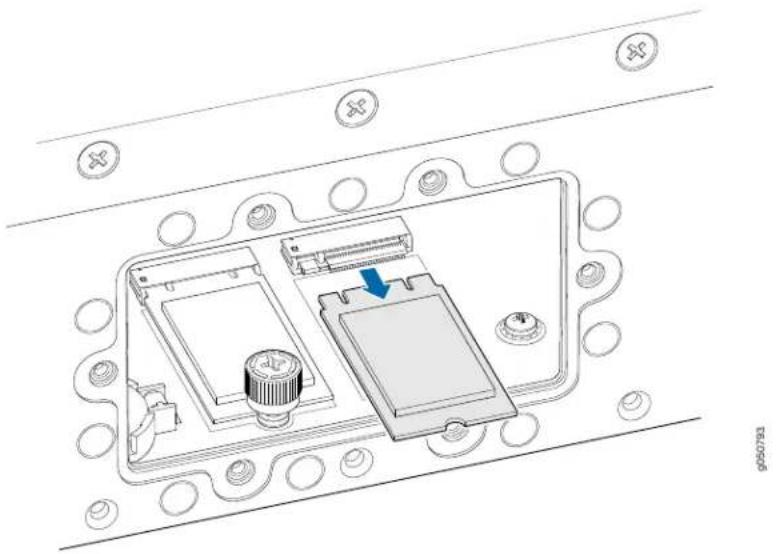 Technical diagram of an electronic device with labeled components and a blue arrow indicating a component or connection.