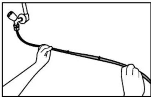 Illustration of hands holding a cable with a connector attached (no text or symbols).
