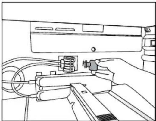 Line drawing of a hand inserting a component into a device (no text or symbols).