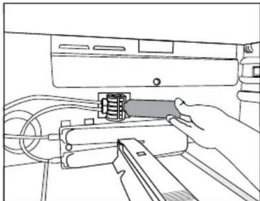 Line drawing of a hand inserting a USB into a device (no text or symbols)