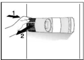 Diagram showing a hand holding a cylindrical object with labeled parts 1 and 2, likely illustrating a mechanical or electrical component.