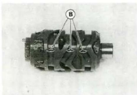 Mechanical component with internal cavities and a labeled component B (no readable text or symbols)