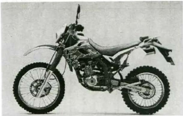 Side profile of a modified off-road motorcycle with visible wheel and suspension components (no text or symbols)