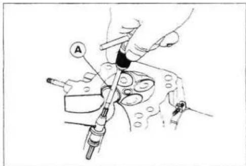 Technical diagram showing mechanical assembly with labeled component 'A' and tool handle