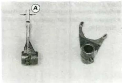Two mechanical components: a cylindrical rod with cross-shaped end and a curved bracket with a hole (no visible text or symbols)