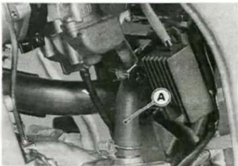 Close-up mechanical assembly showing internal components like hoses and a valve (no visible text or symbols)