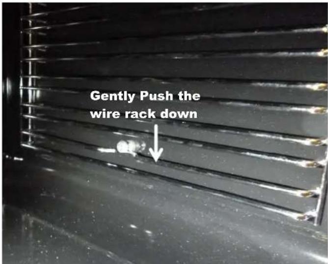 Gently Push the wire rack down