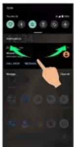 Mobile phone interface screenshot showing navigation controls and a hand pointing to a green arrow with a circular icon.
