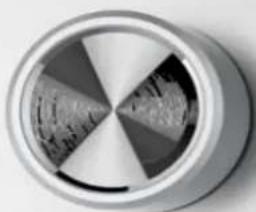 Close-up of a metallic cylindrical object with a petal-like pattern and internal segments (no text or symbols visible)