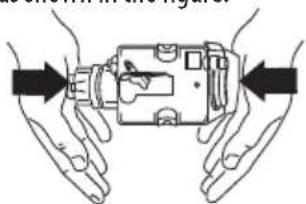 Illustration of two hands holding a mechanical device with arrows indicating direction (no text or symbols)