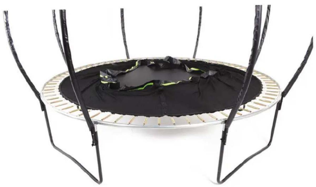 Top trampoline with black cushion and green accents, supported by four metal legs (no text or symbols visible)