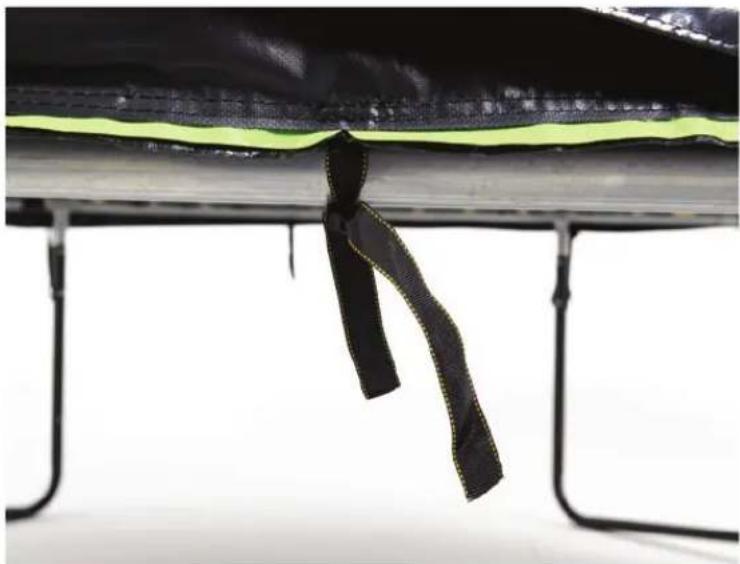 Close-up of a black and lime-colored striped cable or strap attached to a metal frame, with no visible text or symbols.