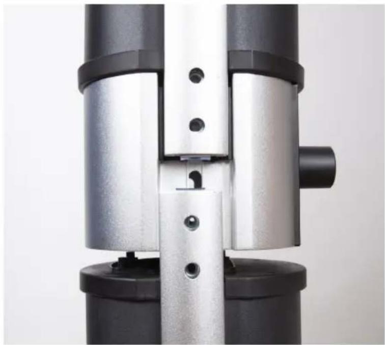 Close-up of a mechanical assembly with metallic and black components, no visible text or symbols
