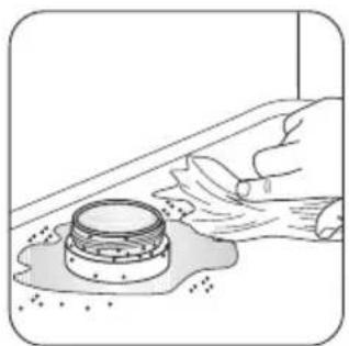Illustration of a hand using a tool to clean or store food items on a surface (no text or symbols visible)