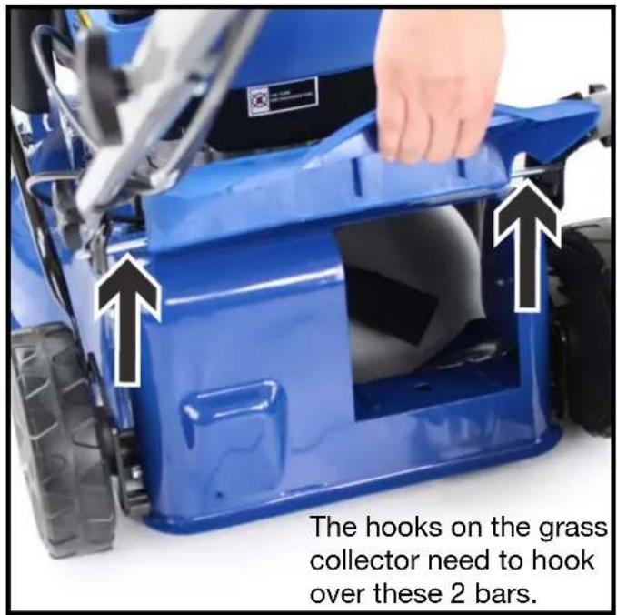 The hooks on the grass collector need to hook over these 2 bars.