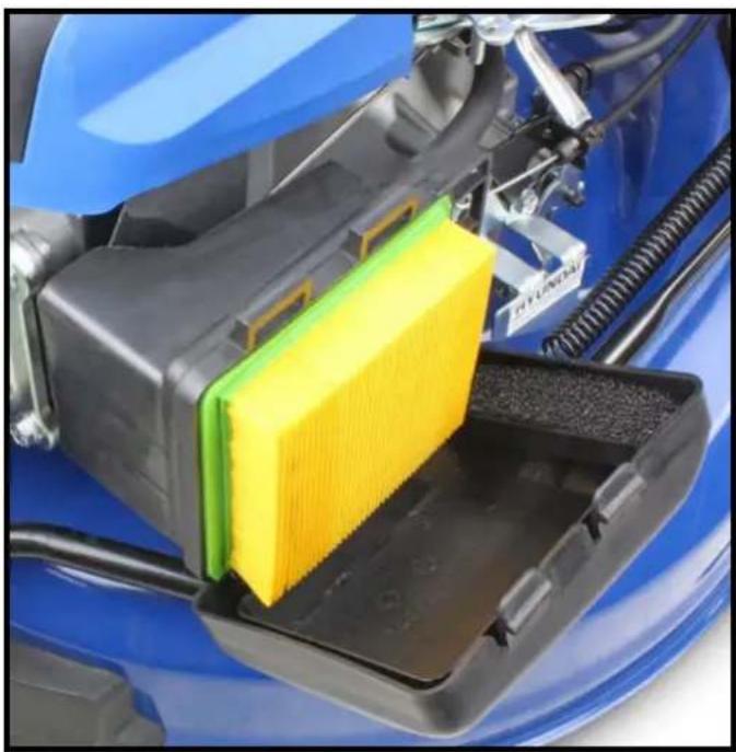 Close-up of a blue car body with a yellow filter component inserted into a black plastic tray (no visible text or symbols)