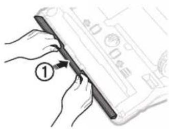 Diagram showing hands holding a pen with a numbered label '1' pointing to the pen tip, likely illustrating a technical or mechanical process.