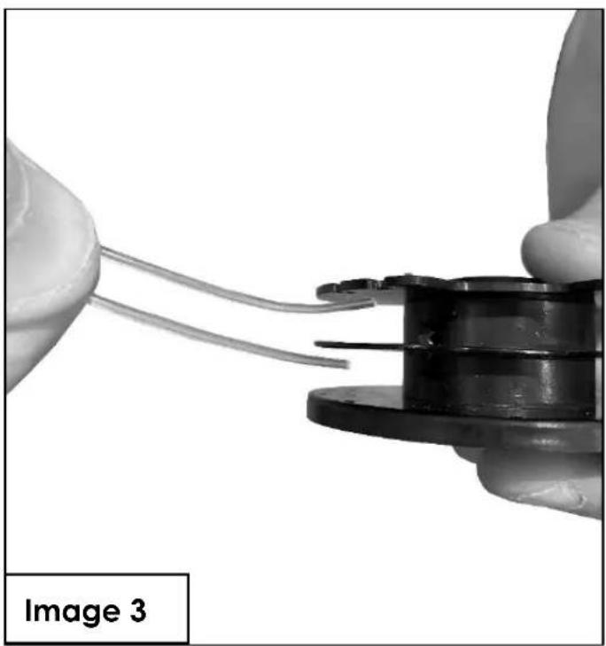 Close-up of hands holding a mechanical component with wires, labeled 'Image 3' in the corner (no other text or symbols)