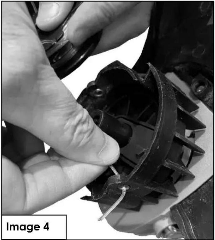 Close-up of hands adjusting a mechanical component with visible internal structure (no text or symbols)