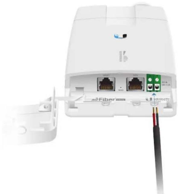 Close-up of a white wireless router with two Ethernet ports and a cable connector (no visible text or symbols)