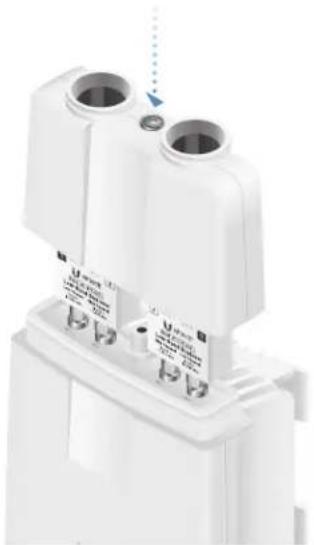 Close-up of a white electrical component with two cylindrical ports and a base, showing no visible text or symbols.