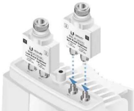 Close-up of two U-shaped electronic components with metallic pins and blue indicator lights, no visible text or symbols.