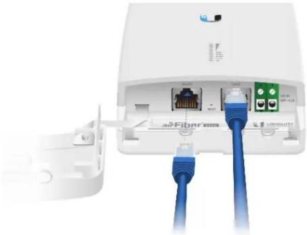 White wireless router with attached network ports and blue cables, no visible text or symbols