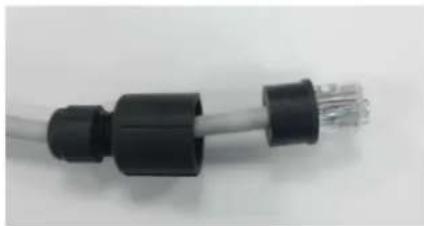 Close-up of a black and silver electrical plug connector (no text or symbols visible)