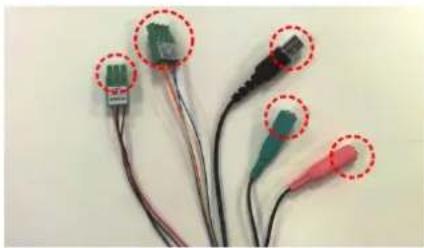 Close-up of multiple electronic connectors with colored wires and connectors, no visible text or symbols