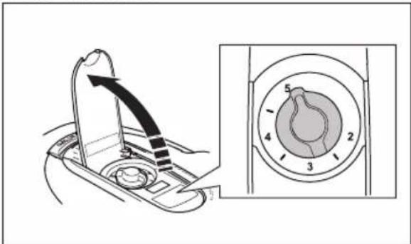 Diagram showing a mechanical component with an arrow indicating direction and a circular dial with numbered parts, alongside a magnified view of the dial.