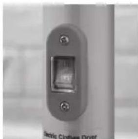 Close-up of a metallic electrical switch with screw holes and a label reading 'Electric Clothes Dryer' (no other text or symbols visible)