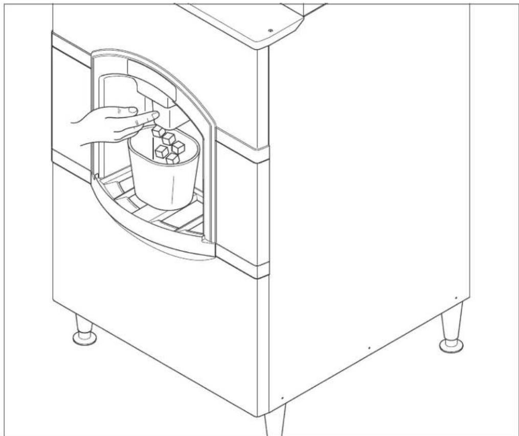 Line drawing of a hand placing a container into a cylindrical chamber with a bucket, no text or symbols present