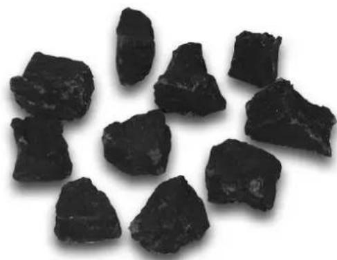 Close-up of several dark, irregularly shaped objects on a white background (no text or symbols visible)