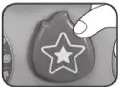Hand holding a star-shaped object with a leaf-like shape (no text or symbols visible)