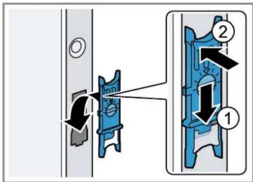 Diagram showing a mechanical assembly with labeled parts and directional arrows indicating motion or assembly.