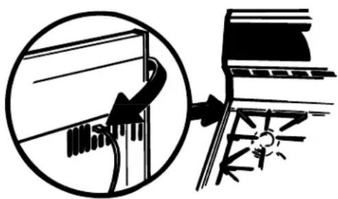 Diagram showing a musical instrument being inserted into a guitar, with no visible text or symbols