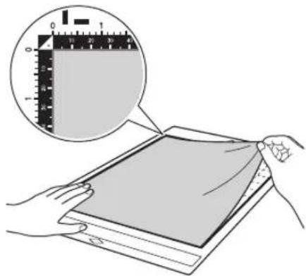 Illustration showing a hand holding a folded document with a ruler and magnified view of the paper's edge detail.
