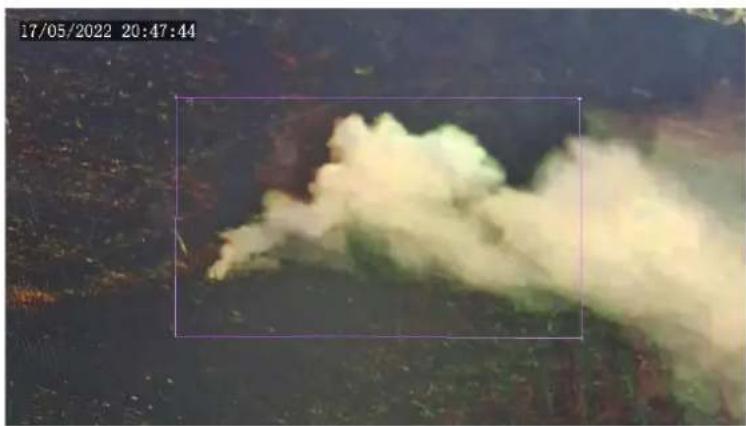 Aerial view of a large smoke plume in a dark, forested area, captured at 20:47:44 on 17/05/2022 (no visible text or symbols)