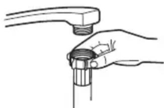 Line drawing of a hand holding a pipe fitting with a handle (no text or symbols).