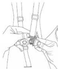Line drawing of hands holding a small object, possibly a device or tool, with no visible text or symbols.