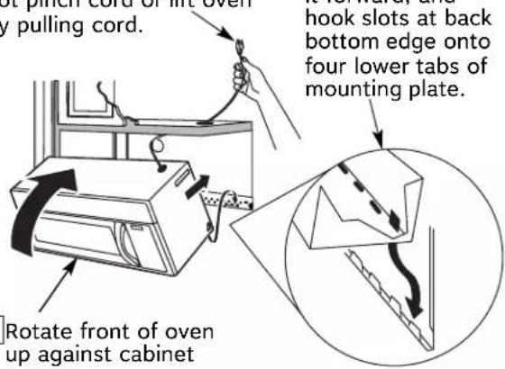 not pinch cord of fire oven y pulling cord. hook slots at back bottom edge onto four lower tabs of mounting plate. Rotate front of oven up against cabinet