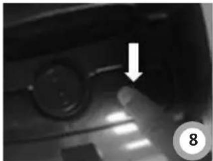 Close-up of a mechanical component with a circular feature and an arrow pointing to a detail (no visible text or symbols)