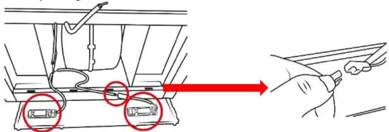 Diagram showing cable installation process with red arrows indicating direction of movement, highlighting two components with red circles.